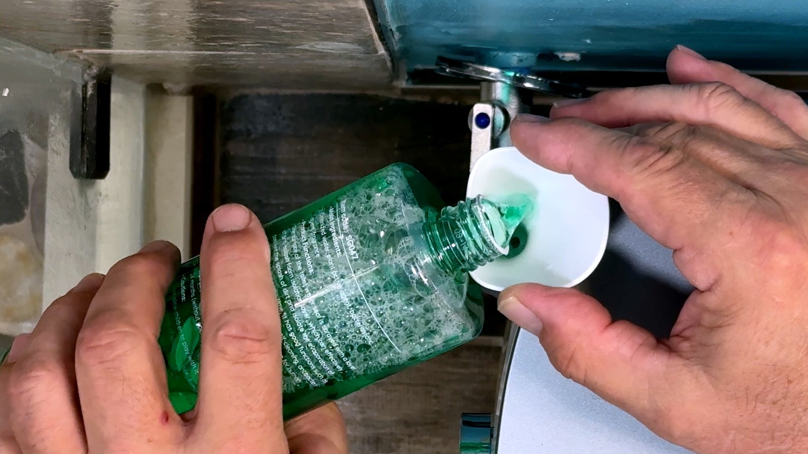 Foam Shield solution being poured into a funnel